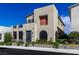 Modern two-story home features a unique architectural design, neutral color scheme, well-manicured landscaping, and privacy wall at 2518 Veronella St, Henderson, NV 89044