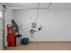 The garage has painted walls and floors, with an electric vehicle charging station, and ample space for a vehicle at 2518 Veronella St, Henderson, NV 89044