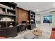 Beautiful home office features custom built-ins, sleek modern furniture, and sliding glass doors at 2518 Veronella St, Henderson, NV 89044