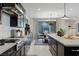 Open kitchen boasts a large island, stainless steel appliances, and seamless transition to the dining area at 2518 Veronella St, Henderson, NV 89044