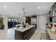 Spacious kitchen with stainless steel appliances, a large island, and easy access to the outdoor patio at 2518 Veronella St, Henderson, NV 89044