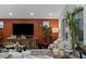 Cozy living room with designer paint, stylish décor, plush seating and plenty of natural light at 2518 Veronella St, Henderson, NV 89044