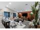 This living room offers a comfortable seating area and entertainment center with a sleek design and neutral colors at 2518 Veronella St, Henderson, NV 89044