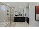 Sleek bathroom boasts a glass shower, double vanity, and contemporary design elements at 2518 Veronella St, Henderson, NV 89044