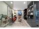 Stylish home office featuring built-in shelving, a comfortable seating area, and ample workspace at 2518 Veronella St, Henderson, NV 89044