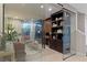 Home office with glass sliding doors, custom cabinetry and ample natural light at 2518 Veronella St, Henderson, NV 89044