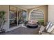 Cozy patio area with stylish seating and seamless indoor-outdoor flow with dining room in view at 2518 Veronella St, Henderson, NV 89044