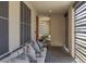 Inviting outdoor patio with comfortable seating and privacy screens for relaxed living at 2518 Veronella St, Henderson, NV 89044