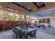 Covered outdoor patio, dining area with seating and built-in outdoor grill for entertaining at 2518 Veronella St, Henderson, NV 89044