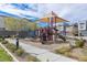 This community playground features slides, stairs, shade and benches, providing a fun outdoor experience for families at 2518 Veronella St, Henderson, NV 89044