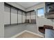 Spacious walk-in closet with custom shelving, modern fixtures, and natural light at 2518 Veronella St, Henderson, NV 89044