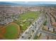 Community aerial featuring baseball and soccer fields, tennis courts, and green spaces at 2606 Marvel Astoria St, Henderson, NV 89044