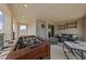 Spacious balcony with a foosball table and comfortable seating, perfect for outdoor entertaining and relaxation at 2606 Marvel Astoria St, Henderson, NV 89044