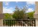 Scenic balcony view of lush trees, landscaping, and neighborhood in a residential area at 2606 Marvel Astoria St, Henderson, NV 89044