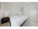 This bright bedroom includes a queen size bed, a closet, and a modern style bedside table at 2606 Marvel Astoria St, Henderson, NV 89044