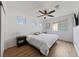 Bright bedroom with multiple windows, ceiling fan, and a wall-mounted TV offers a comfortable living space at 2606 Marvel Astoria St, Henderson, NV 89044