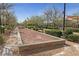 Neighborhood bocce ball court amidst tree-lined walkways and landscaping, for community residents at 2606 Marvel Astoria St, Henderson, NV 89044