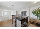 Bright dining area features modern furniture and a sliding glass door, perfect for entertaining and relaxing at 2606 Marvel Astoria St, Henderson, NV 89044