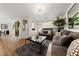 Cozy living room with comfortable sofas, modern decor, and wood-look flooring at 2606 Marvel Astoria St, Henderson, NV 89044