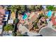 An aerial view of a home featuring a swimming pool, landscaping, a driveway and solar panels at 2771 S Buffalo Dr, Las Vegas, NV 89117