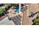 An aerial view of a luxury home featuring a sparkling pool with a diving board and a backyard patio at 2771 S Buffalo Dr, Las Vegas, NV 89117