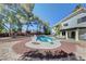 An attractive backyard featuring a beautiful pool with a diving board and lounge chairs at 2771 S Buffalo Dr, Las Vegas, NV 89117