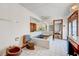 Bathroom featuring a unique blue sunken tub, toilet, bidet and white tile flooring at 2771 S Buffalo Dr, Las Vegas, NV 89117