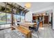 Bright dining area with rustic wooden table, bench seating and view of the backyard pool at 2771 S Buffalo Dr, Las Vegas, NV 89117