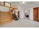 Inviting foyer with tiled flooring, a grand staircase, and an open layout at 2771 S Buffalo Dr, Las Vegas, NV 89117