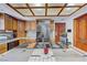 Traditional kitchen showcasing wood cabinets, tiled countertops with a built-in cooktop, and stainless steel refrigerator at 2771 S Buffalo Dr, Las Vegas, NV 89117