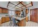 Traditional kitchen with warm wood cabinetry, functional island, and tile countertops at 2771 S Buffalo Dr, Las Vegas, NV 89117