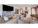 Comfortable living room with hardwood floors, plush seating, and a decorative fireplace at 2771 S Buffalo Dr, Las Vegas, NV 89117