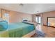 Serene primary bedroom features hardwood flooring, a fireplace, and access to the backyard through French doors at 2771 S Buffalo Dr, Las Vegas, NV 89117