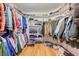 Spacious walk-in closet with ample hanging space and shelving for shoes and folded clothes at 2771 S Buffalo Dr, Las Vegas, NV 89117