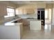 Spacious kitchen with an island, ample counter space, and modern appliances perfect for cooking at 2830 Queens Courtyard Dr, Las Vegas, NV 89109