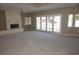 Large living room featuring a fireplace and access to the outdoor patio, perfect for entertaining at 2830 Queens Courtyard Dr, Las Vegas, NV 89109