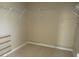 Spacious walk-in closet featuring multiple shelves, rods and ample storage space for organizing clothes and accessories at 2830 Queens Courtyard Dr, Las Vegas, NV 89109