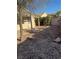 Well-maintained backyard with desert landscaping, rock covering, and a charming patio area for entertaining at 2839 Kensington St, Las Vegas, NV 89156