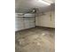 View of the spacious garage with an automatic door and ample room for storage and vehicles at 2839 Kensington St, Las Vegas, NV 89156
