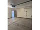 Spacious garage featuring an automatic door and convenient side door access to the exterior at 2839 Kensington St, Las Vegas, NV 89156
