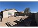 Large backyard with room for activities and entertainment, featuring a covered patio and block fencing at 2845 Kensington St, Las Vegas, NV 89156