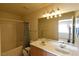 Bathroom features a double sink vanity and a shower-tub combo with curtain at 2845 Kensington St, Las Vegas, NV 89156