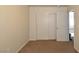 Carpeted bedroom with closet, doors and a view into the hallway at 2845 Kensington St, Las Vegas, NV 89156