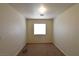 A carpeted bedroom with a single window at 2845 Kensington St, Las Vegas, NV 89156