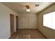 Bedroom featuring carpeted floor, neutral walls, closet and bright window at 2845 Kensington St, Las Vegas, NV 89156