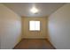 Small, carpeted bedroom featuring a single window at 2845 Kensington St, Las Vegas, NV 89156