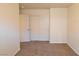 Carpeted bedroom with closet, doors at 2845 Kensington St, Las Vegas, NV 89156
