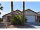 Charming single-story home featuring a two-car garage and desert landscaping at 2845 Kensington St, Las Vegas, NV 89156
