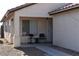 Cozy front porch seating area featuring two chairs and tile flooring at 2845 Kensington St, Las Vegas, NV 89156