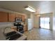 Well-lit eat-in kitchen with stainless steel appliances and neutral flooring at 2845 Kensington St, Las Vegas, NV 89156
